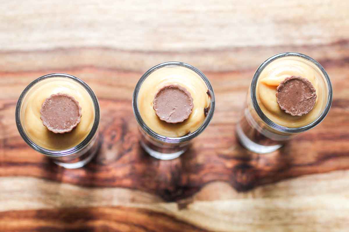 A row of mini chocolate peanut butter parfaits