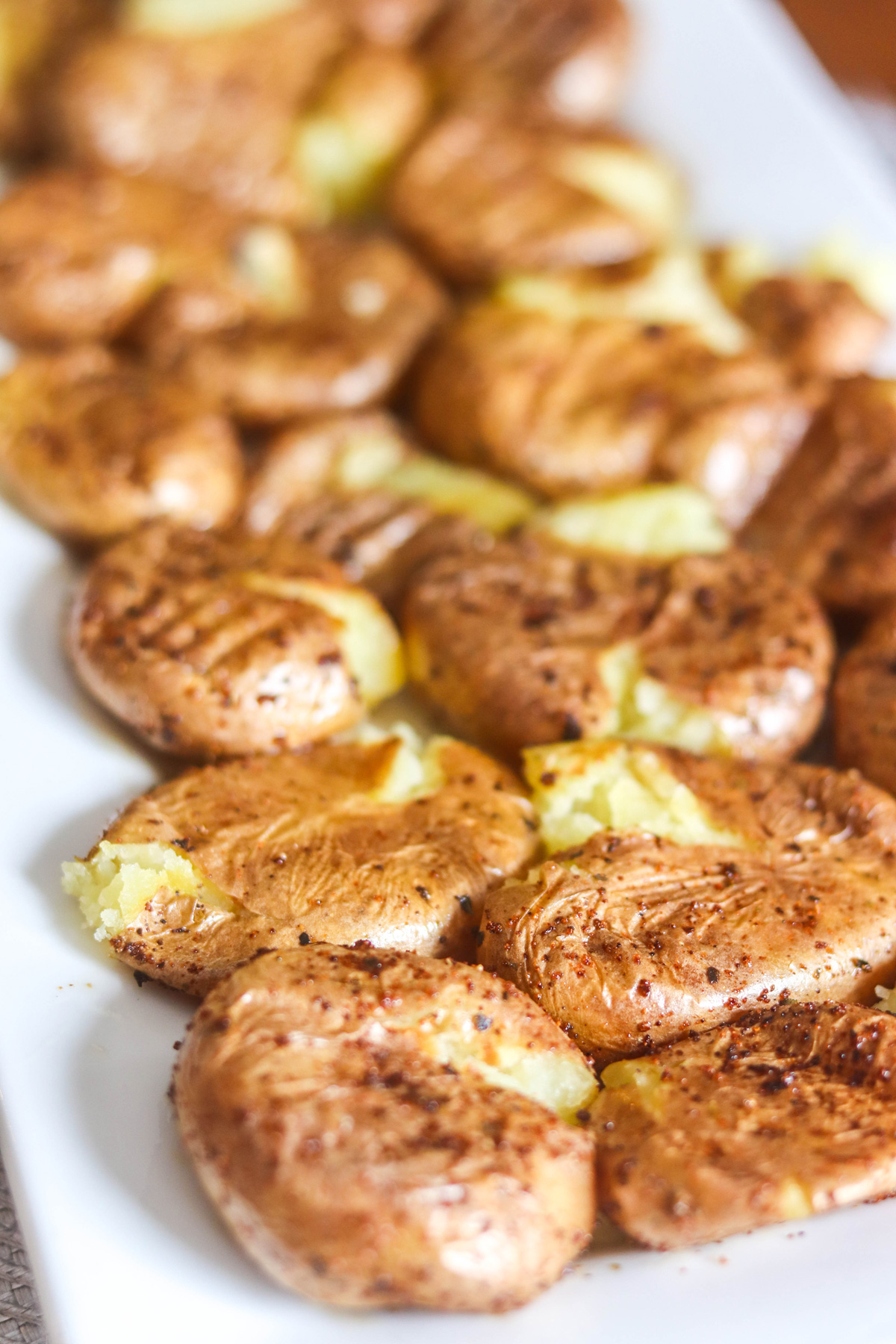 Air Fryer Smashed Potatoes on a White Platter