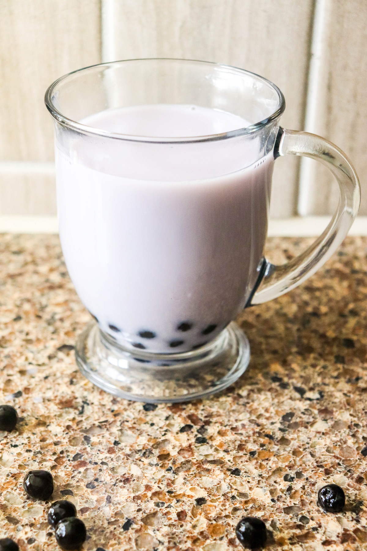 Blueberry Bubble Tea with Boba Pearls on a Countertop