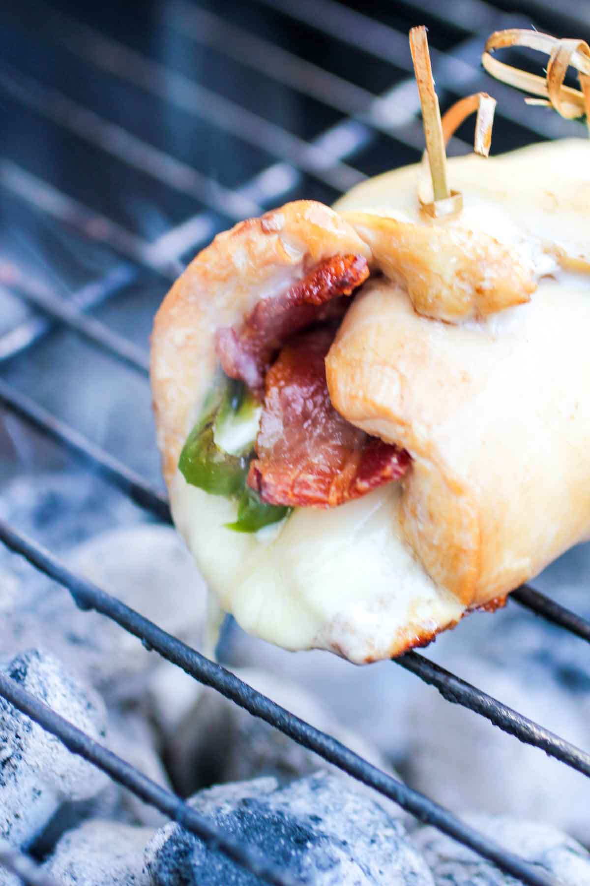 Cheesy Jalapeno Bacon Chicken Roll Ups Close Up on Barbecue Grill