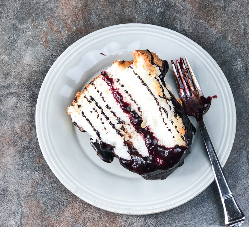 A slice of Easy Angel Food Cake Baked in a Bundt Pan