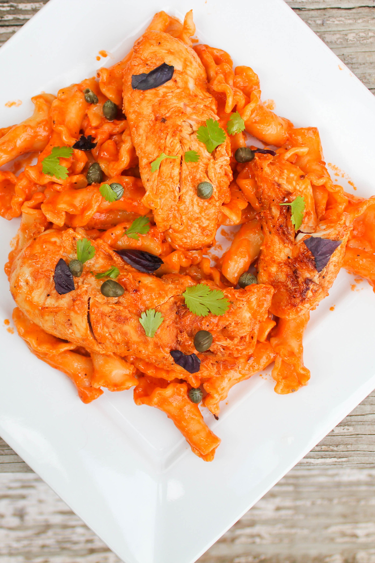 Garlic Tomato Butter Chicken on a White Plate