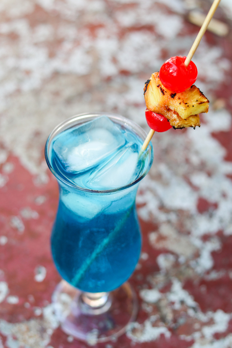 Grilled SpiceGlass of Grilled Spiced Blue Hawaiian Cocktaild Blue Hawaiian Cocktail Glass of Grilled Spiced Blue Hawaiian Cocktail