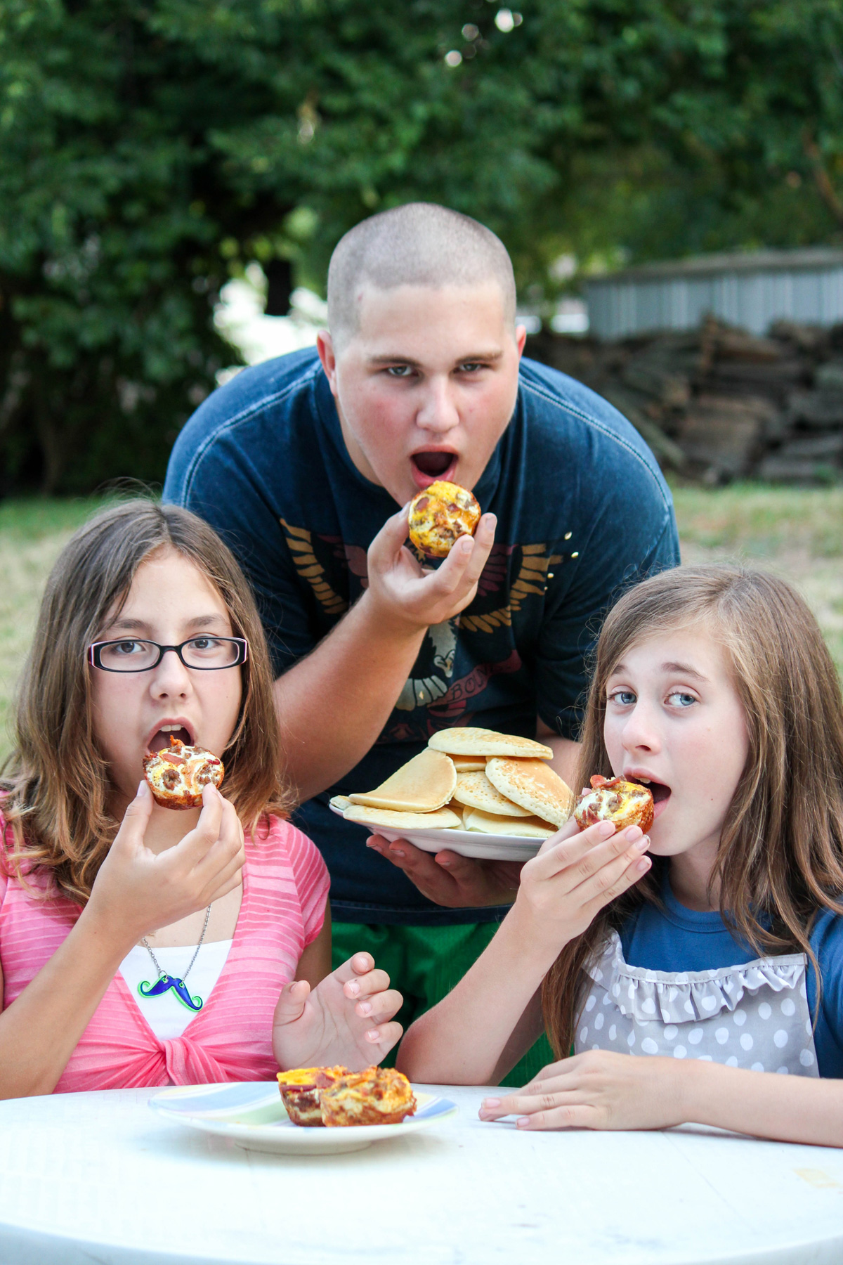 Kids eating Bacon Egg and Sausage Breakfast Cups