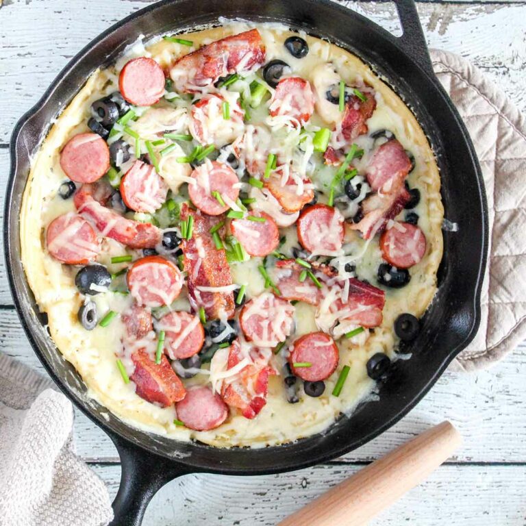 Loaded White Pesto Pizza in a cast iron Skillet