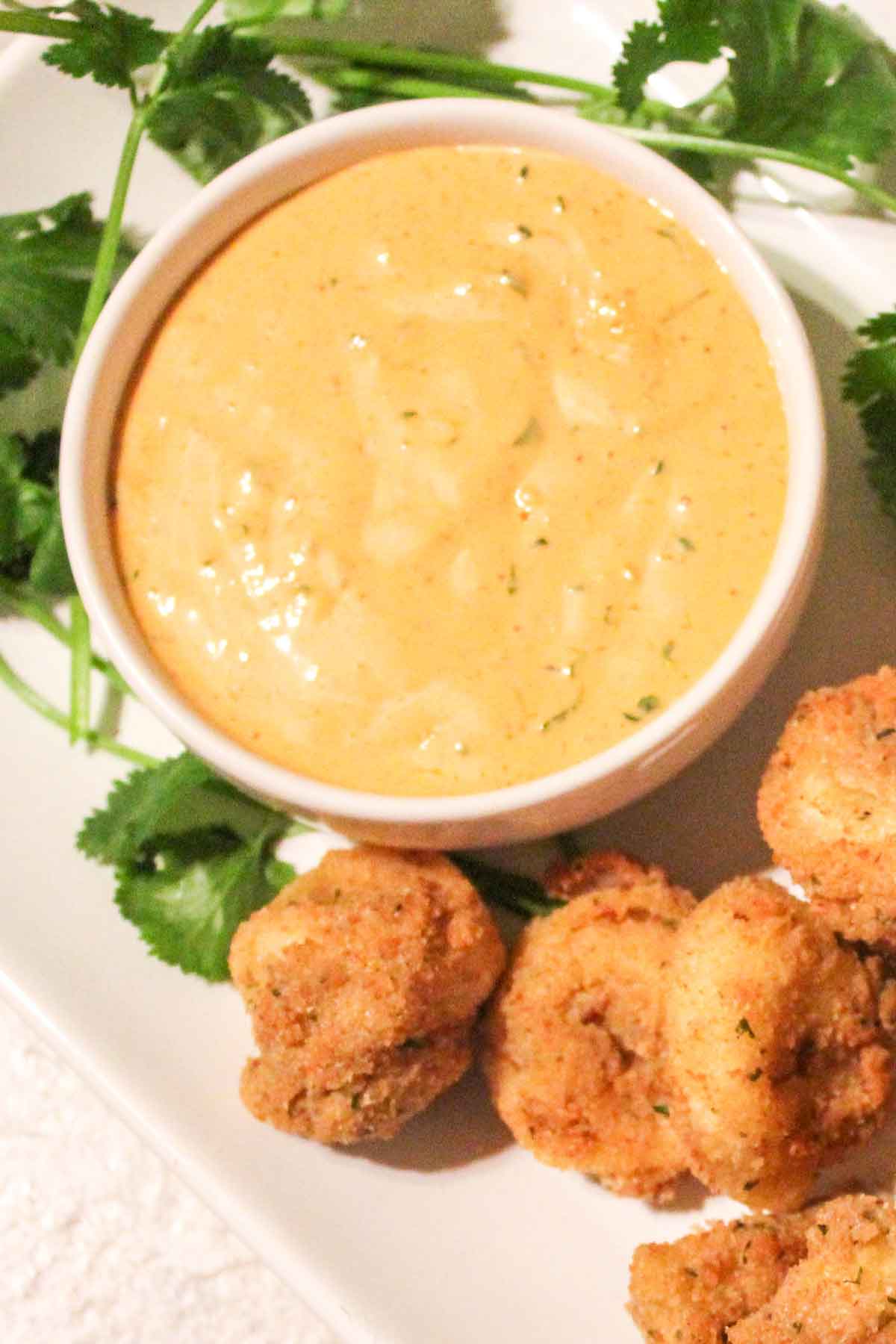 Overhead view of spicy ranch dip in a white bowl
