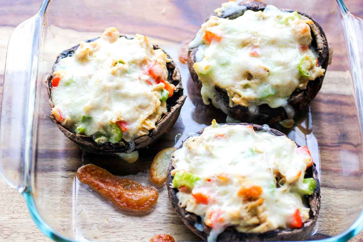 Step 8 - baked portabella stuffed mushrooms in a baking dish.